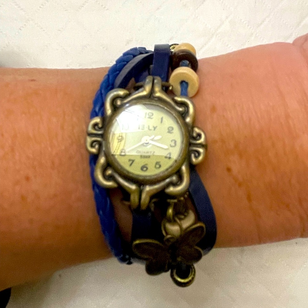 💥2/$21.00💥Antique Gold look wrist watch cw hanging butterfly Blue cord & beads.